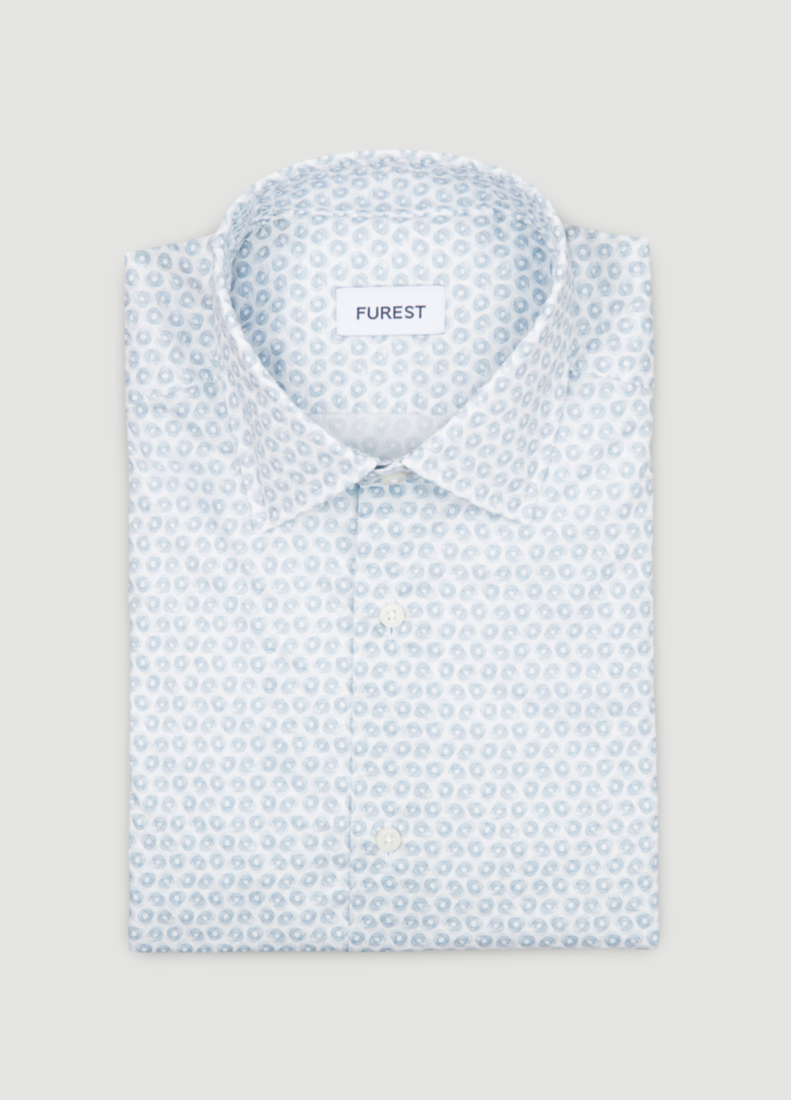 Camisa sport dibujo geométrico celeste.