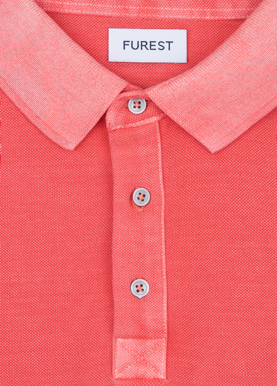 Polo manga corta garment dye pique coral