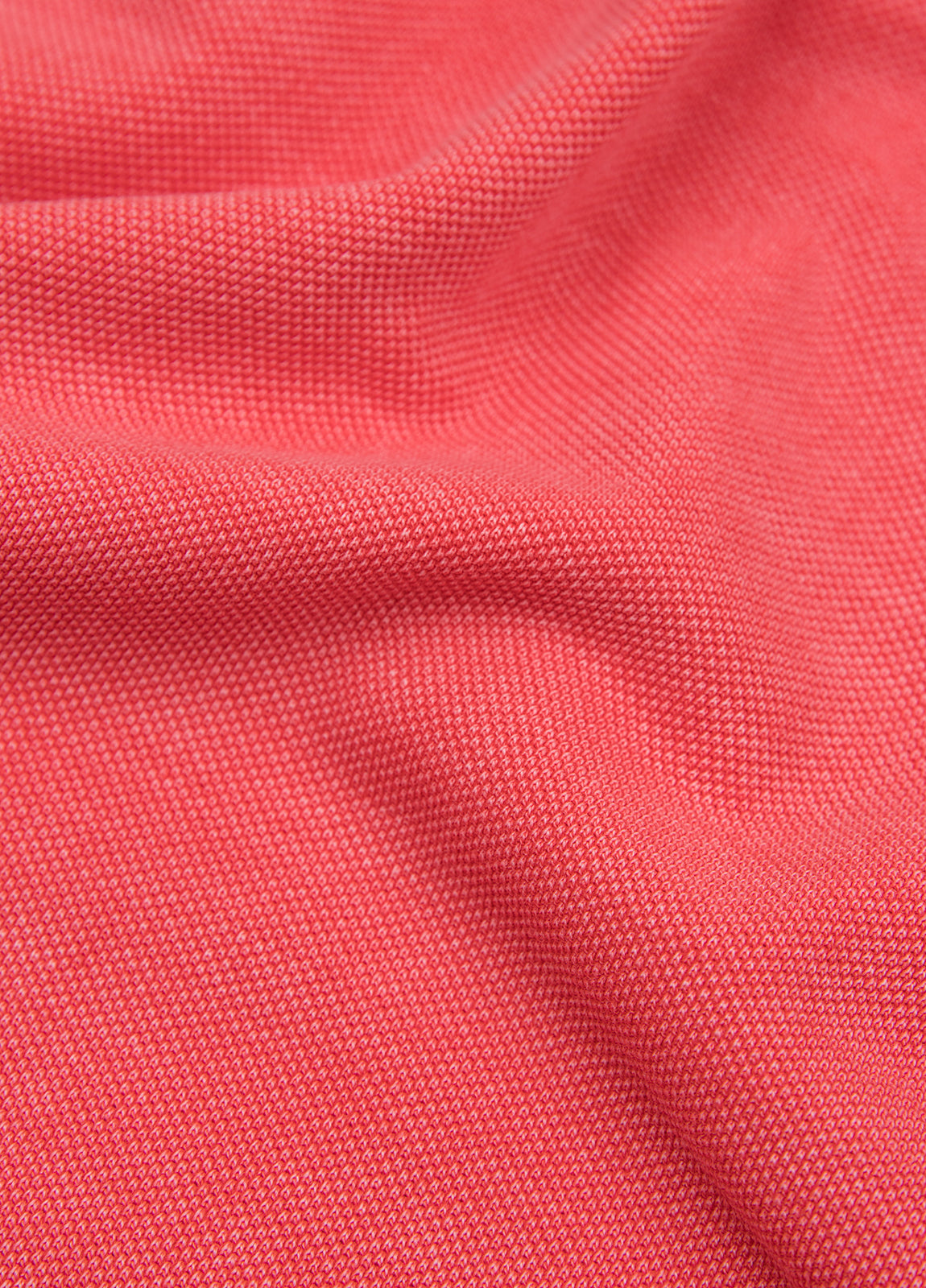 Polo manga corta garment dye pique coral