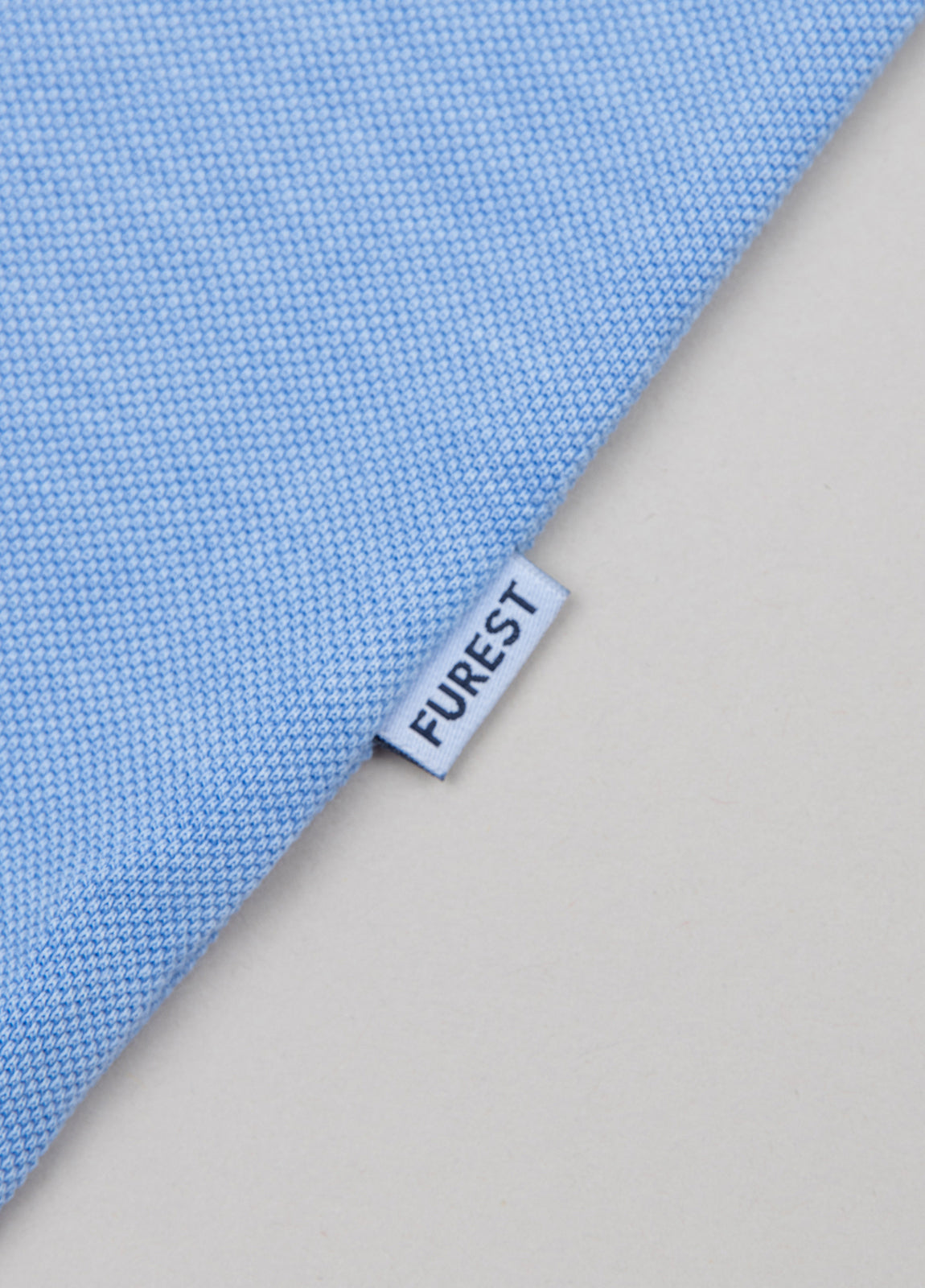 Polo manga corta garment dye pique celeste
