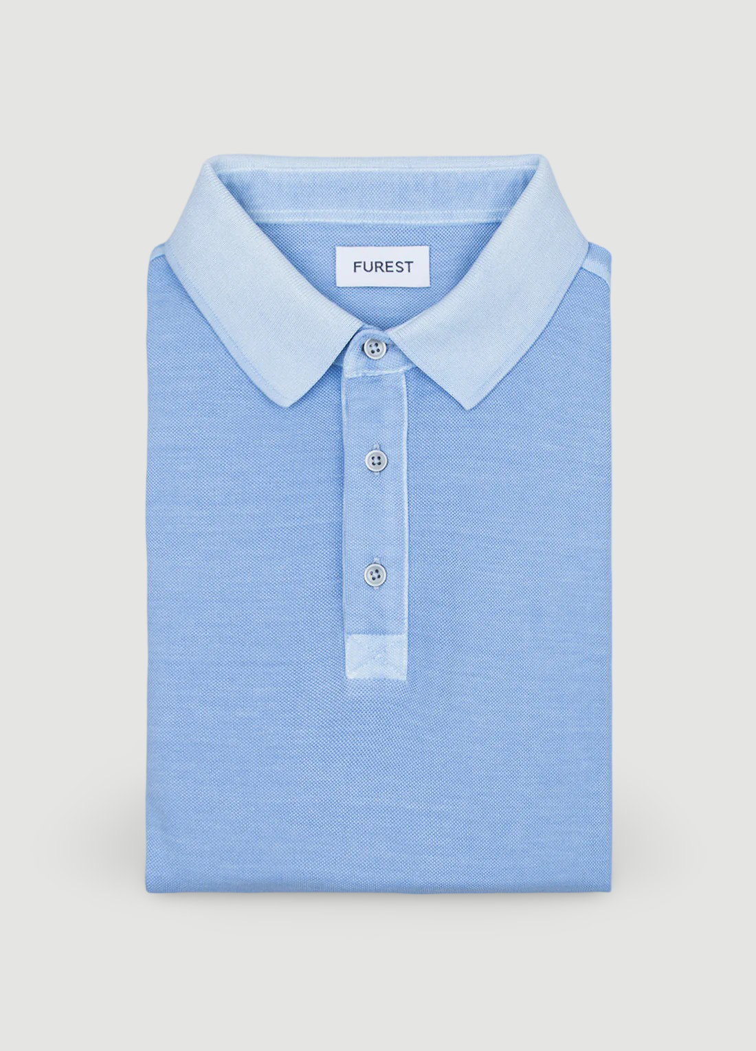 Polo manga corta garment dye pique celeste