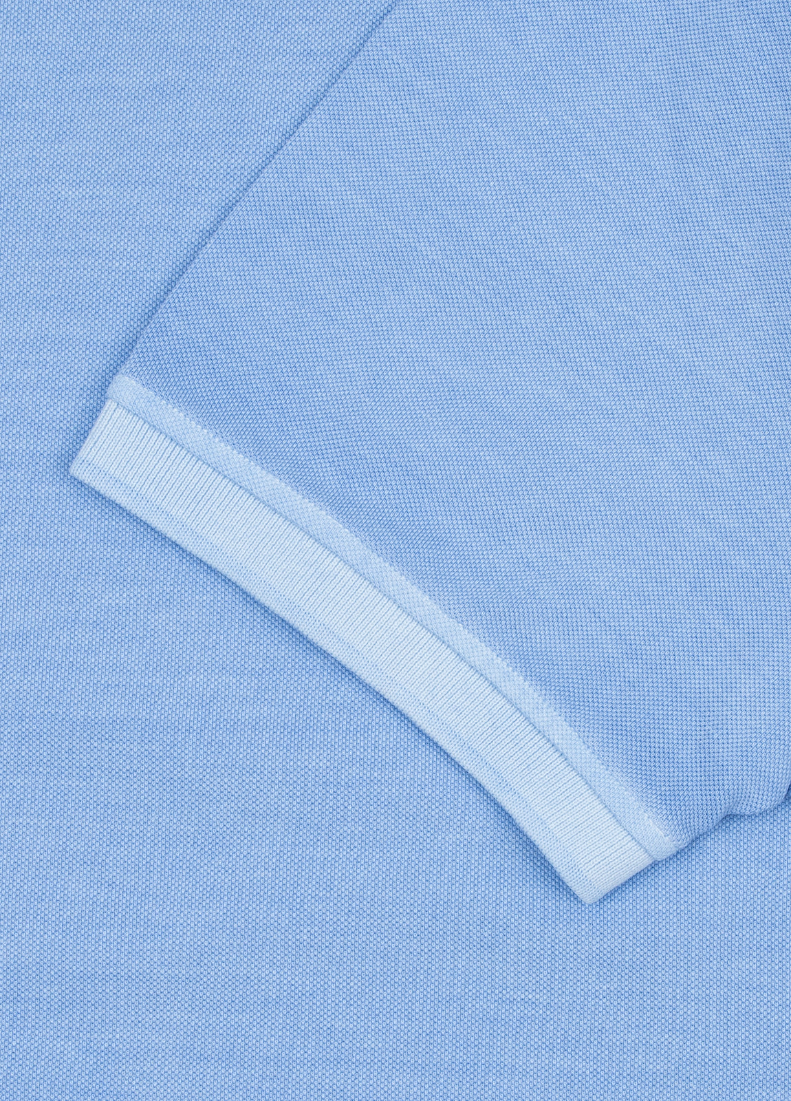 Polo manga corta garment dye pique celeste