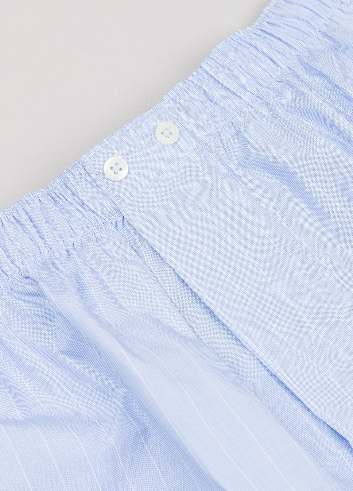 Light blue boxer with white stripes