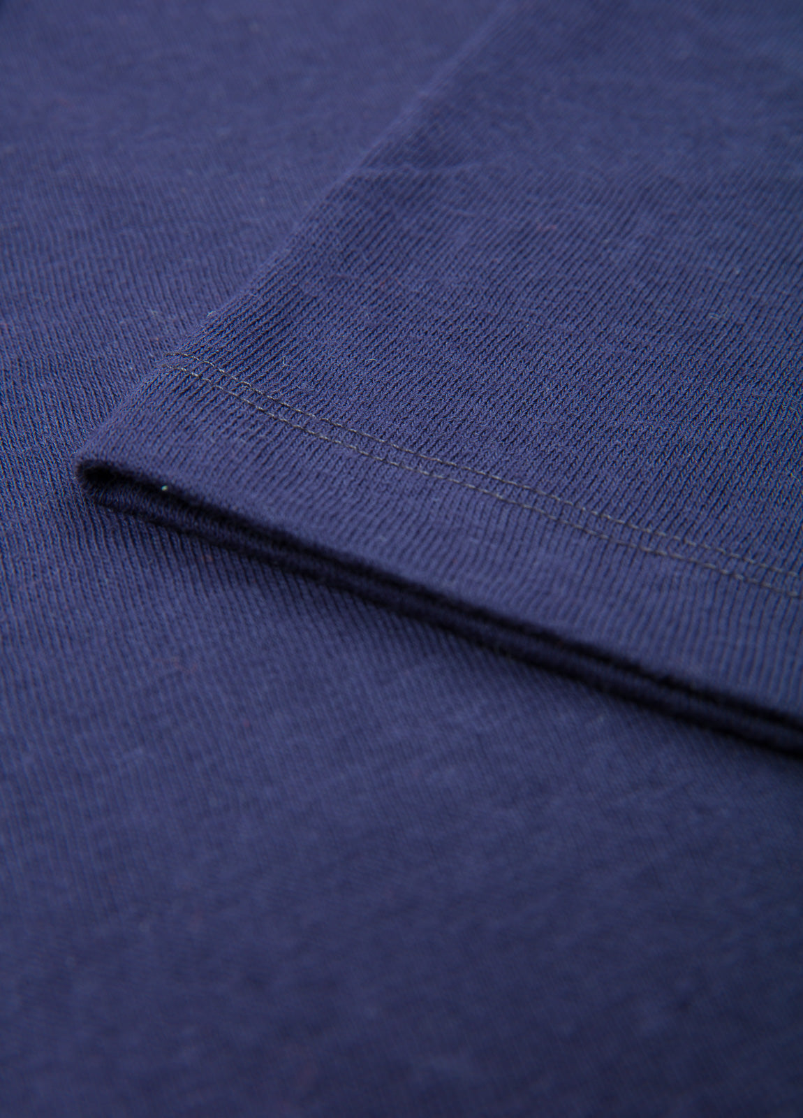 Navy blue V-neck short-sleeved polo shirt.