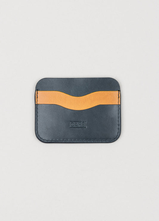 Tarjetero de piel color marino y tostado