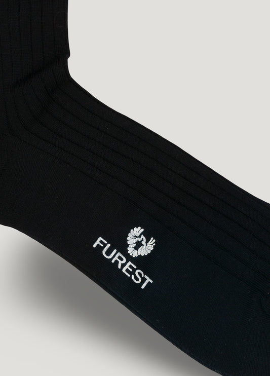 Long navy blue sock made of Scottish yarn