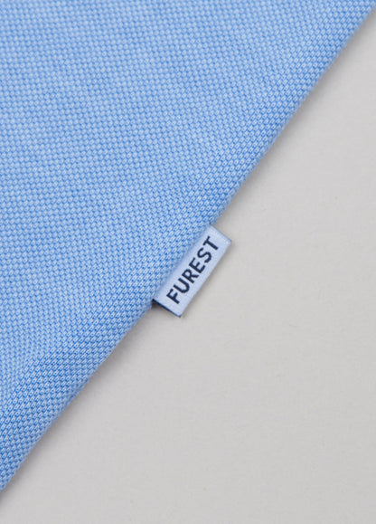 Polo manga corta garment dye pique celeste