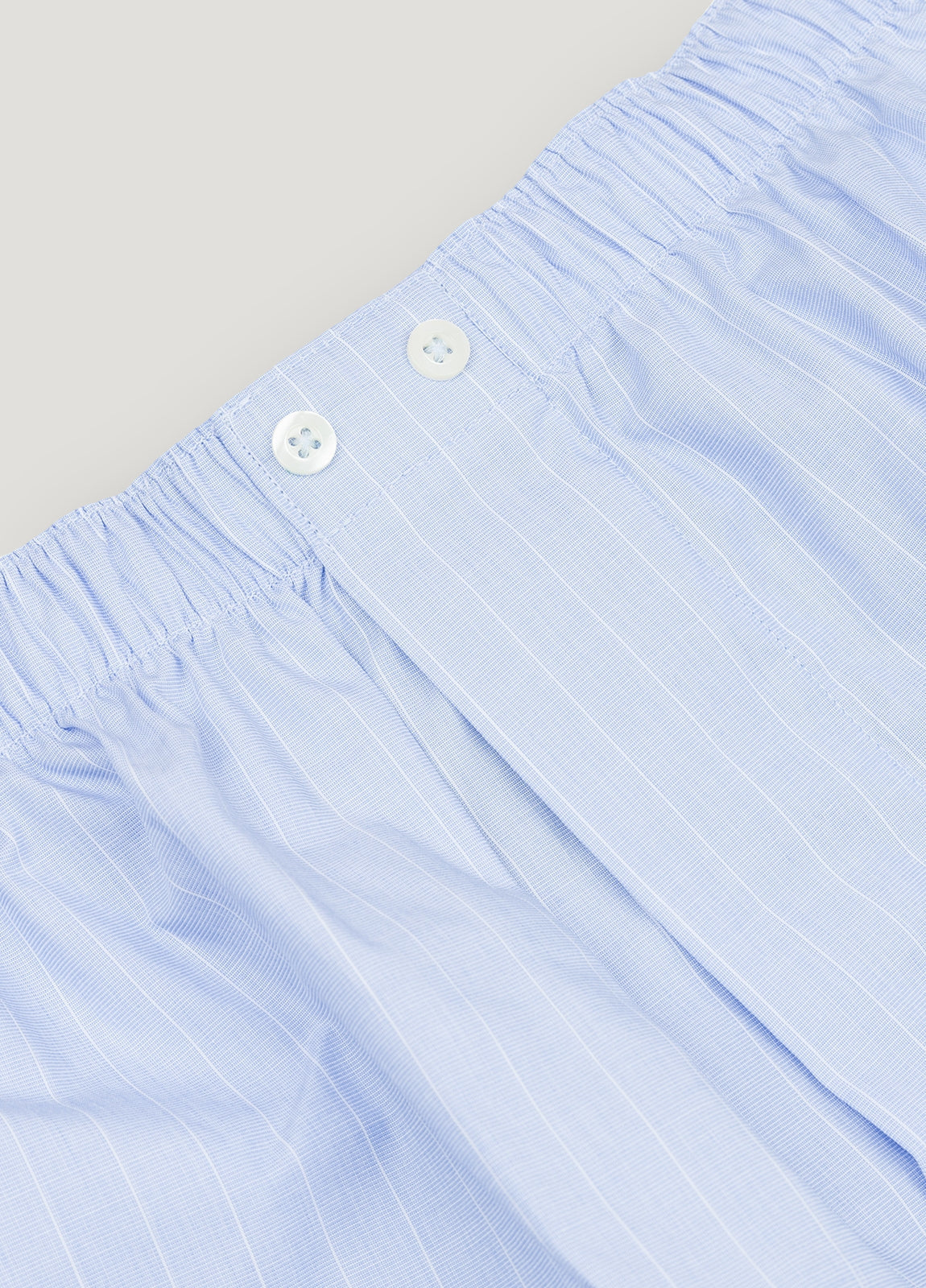 Light blue boxer with white stripes