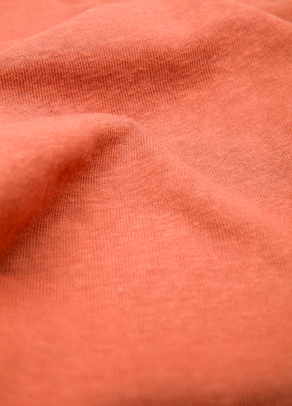 Polo manga corta cuello V teja.