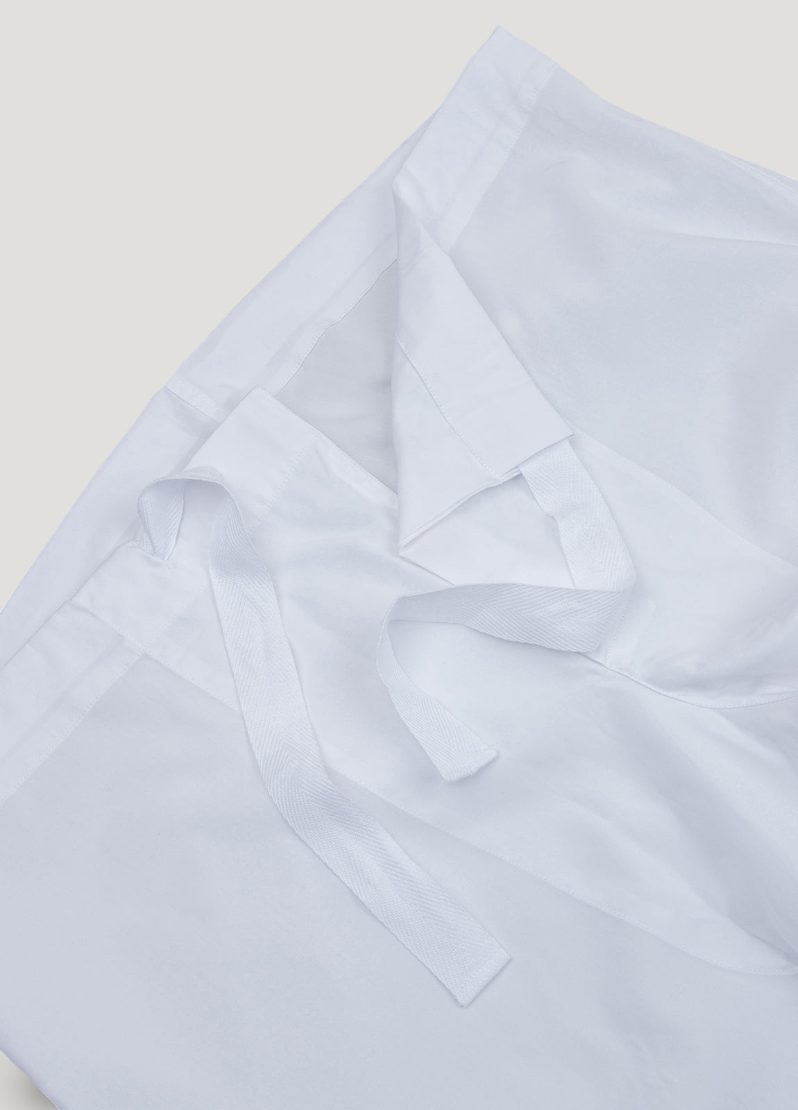 Pijama largo liso blanco con funda incluida