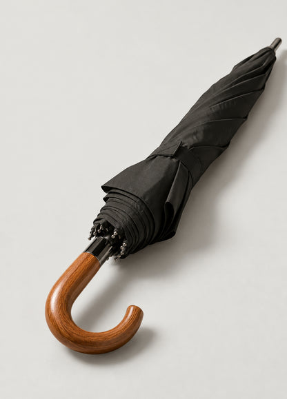 Paraguas plegable negro con puño de madera