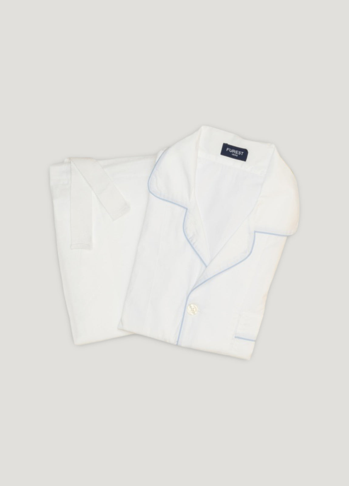 Pijama largo liso blanco y ribete azul con funda incluida
